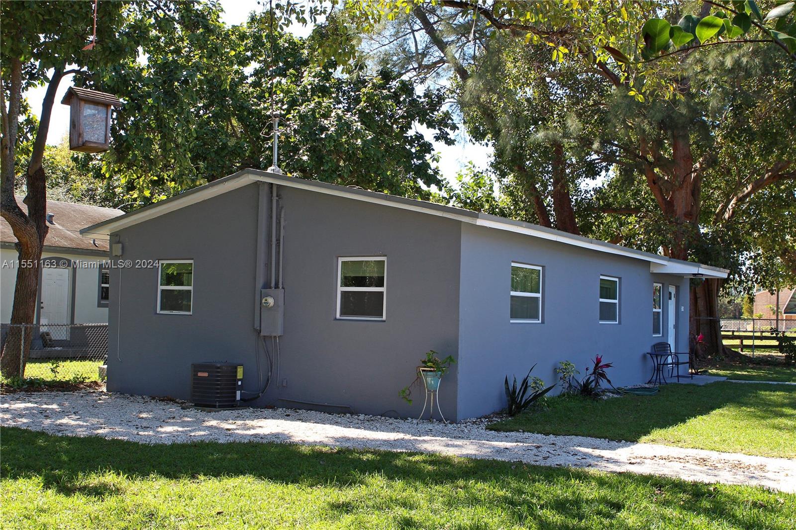 Gladeview Miami, FL 33147 - Photo 8 of 25 a backyard of a house with yard and outdoor seating