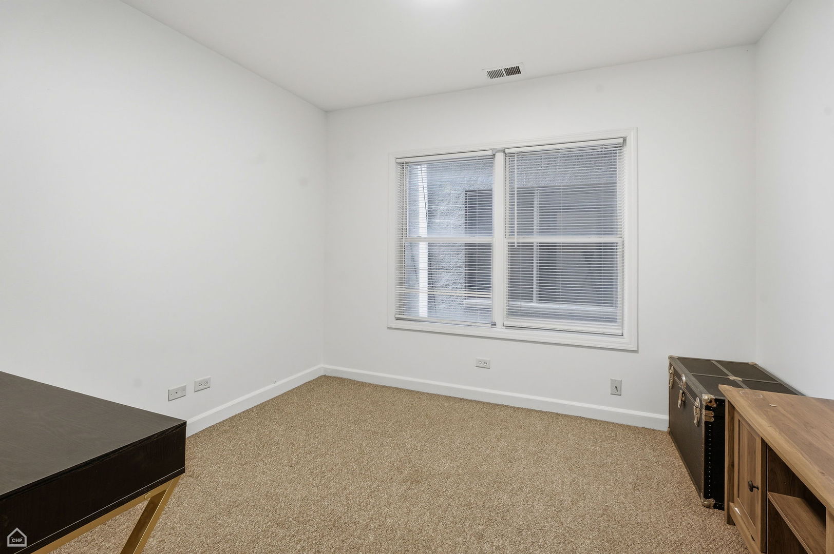 2455 West Harrison Street, Unit 2 Chicago, IL 60612 - Photo 14 of 20 an empty room with a window