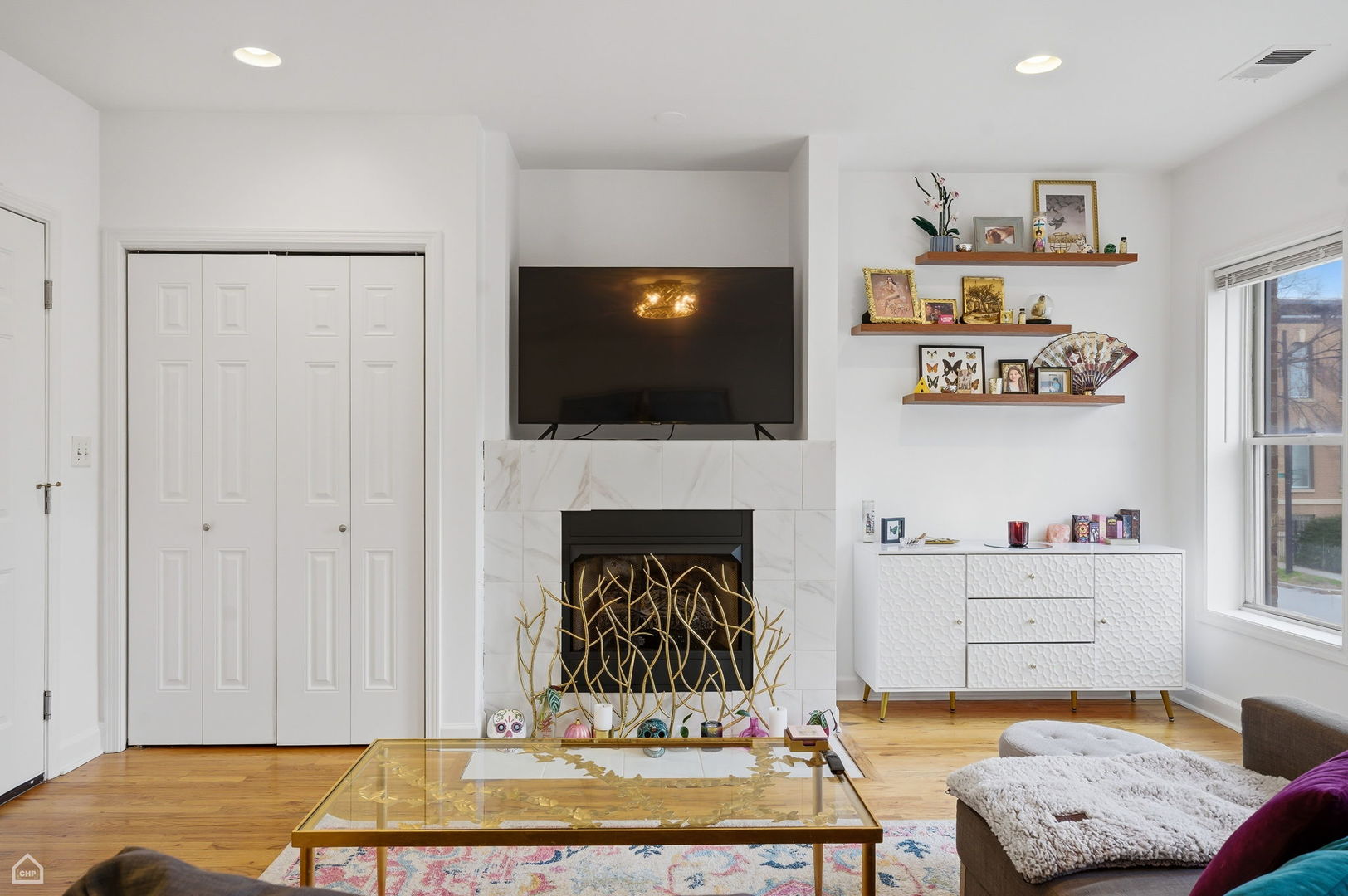 2455 West Harrison Street, Unit 2 Chicago, IL 60612 - Photo 3 of 20 a living room with furniture and a flat screen tv
