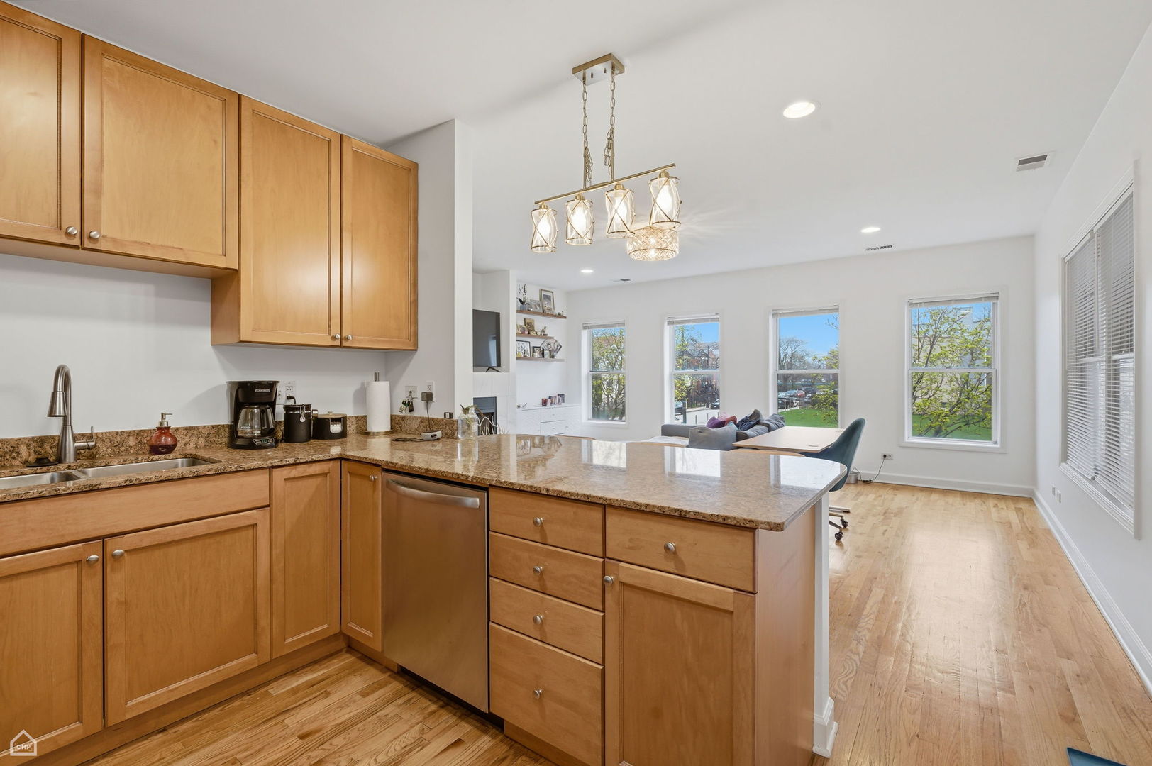 2455 West Harrison Street, Unit 2 Chicago, IL 60612 - Photo 7 of 20 a kitchen with sink a window and chairs