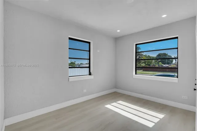 a view of an empty room with a window