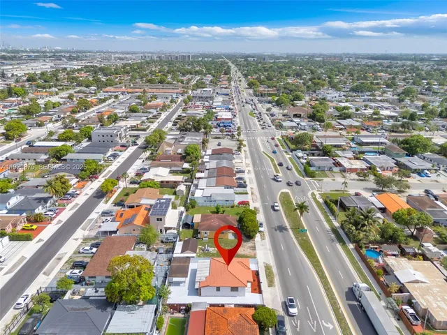 an aerial view of a house with swimming pool