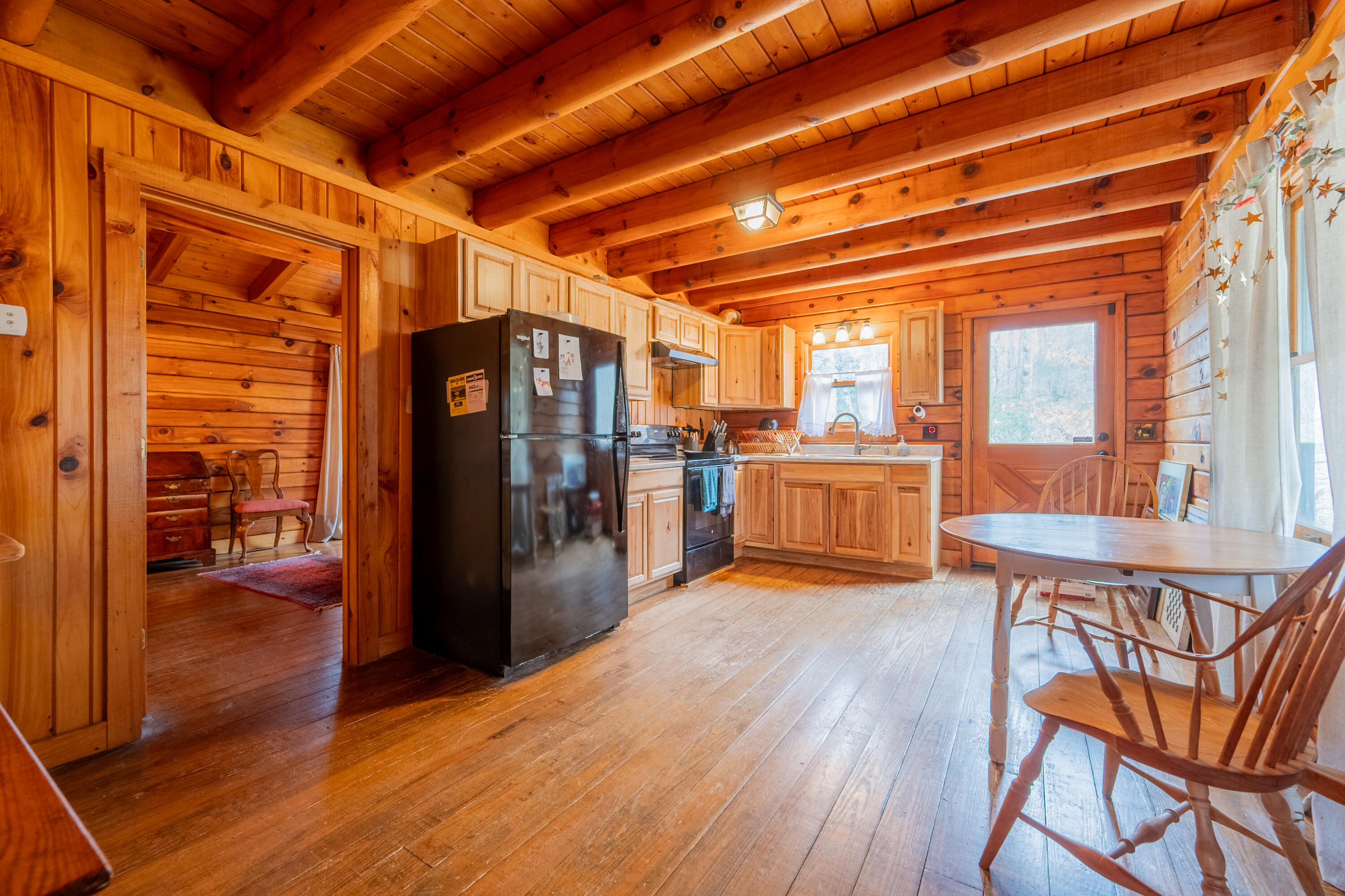 183 Pine Mountain Road Northeast Floyd, VA 24091 - Photo 14 of 54 a view of a kitchen with refrigerator and wooden floor