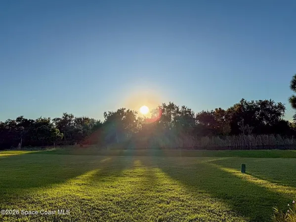 a view of a golf course with a lake