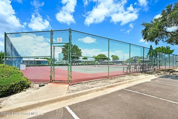 a view of swimming pool with outdoor seating and plants