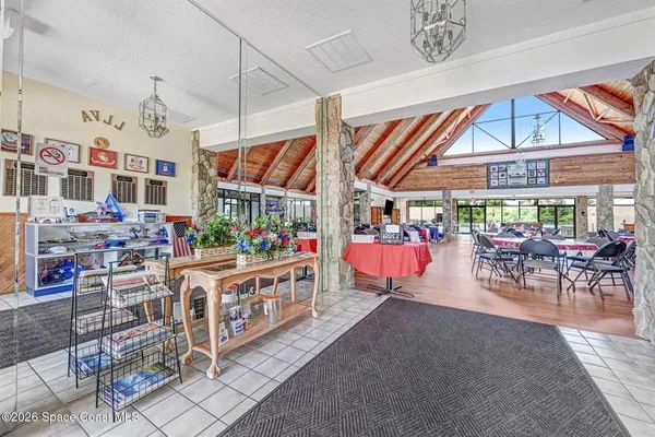 a living room with lots of furniture and a view of chandelier