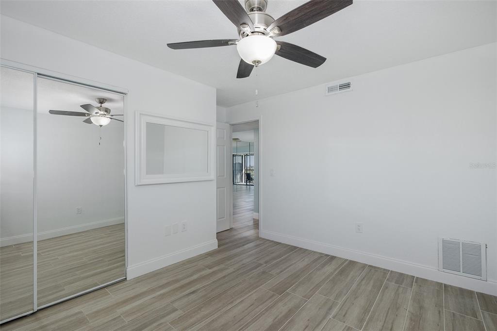 8150 Brent Street, Unit 742 Port Richey, FL 34668 - Photo 17 of 51 wooden floor in an empty room
