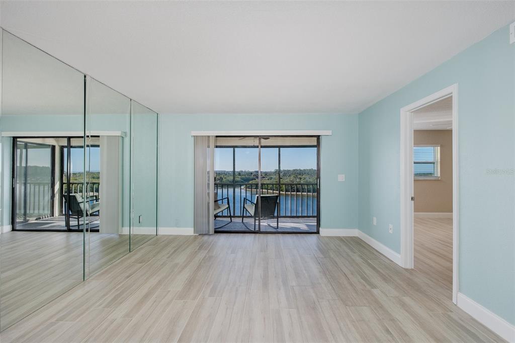 8150 Brent Street, Unit 742 Port Richey, FL 34668 - Photo 22 of 51 wooden floor in an empty room with a window