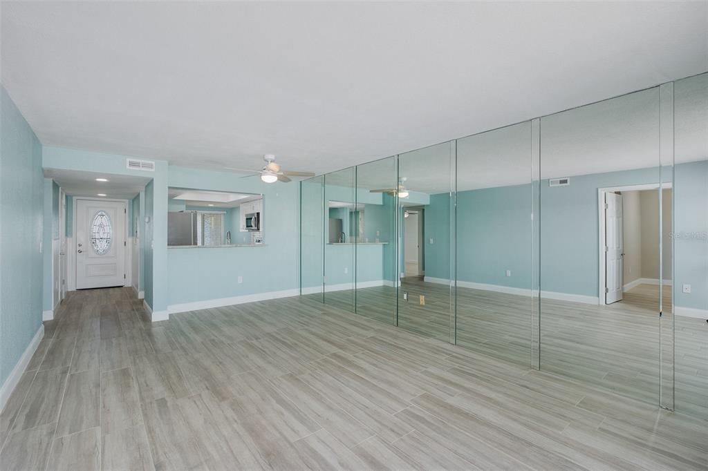 8150 Brent Street, Unit 742 Port Richey, FL 34668 - Photo 24 of 51 a view of an empty room with wooden floor