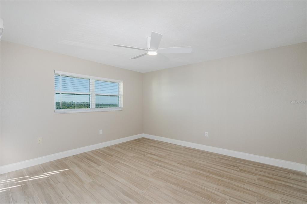 8150 Brent Street, Unit 742 Port Richey, FL 34668 - Photo 26 of 51 wooden floor in an empty room with a window