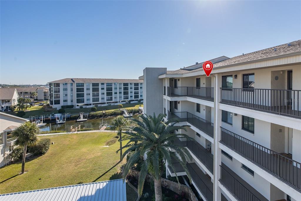 8150 Brent Street, Unit 742 Port Richey, FL 34668 - Photo 40 of 51 a view of a swimming pool with a lounge chairs