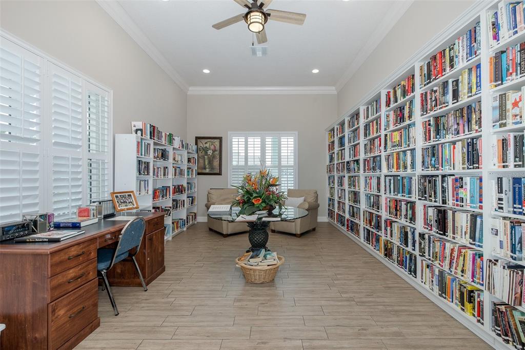 8150 Brent Street, Unit 742 Port Richey, FL 34668 - Photo 47 of 51 a living room with furniture or book shelf and a book shelf