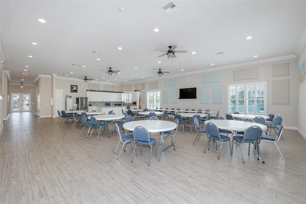 8150 Brent Street, Unit 742 Port Richey, FL 34668 - Photo 50 of 51 a view of a dining room with furniture and wooden floor
