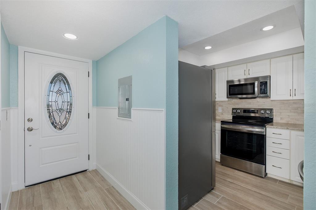 8150 Brent Street, Unit 742 Port Richey, FL 34668 - Photo 5 of 51 a view of kitchen with washer and dryer