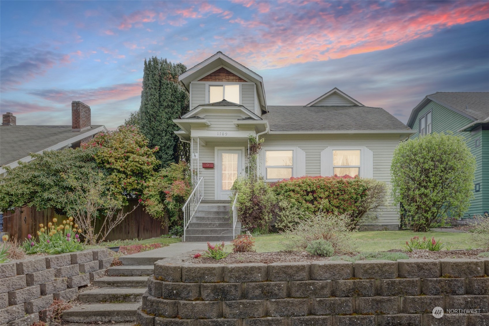 a front view of a house with garden