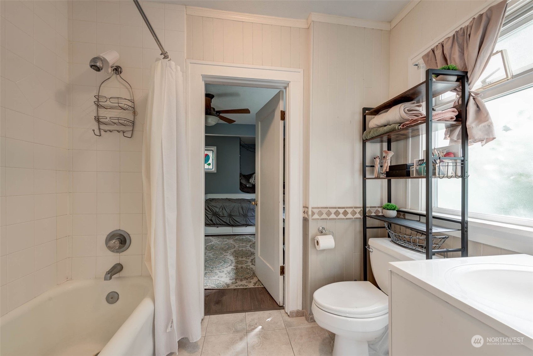 1709 Rainier Avenue Everett, WA 98201 - Photo 14 of 33 a bathroom with a granite countertop bathtub shower sink vanity and toilet