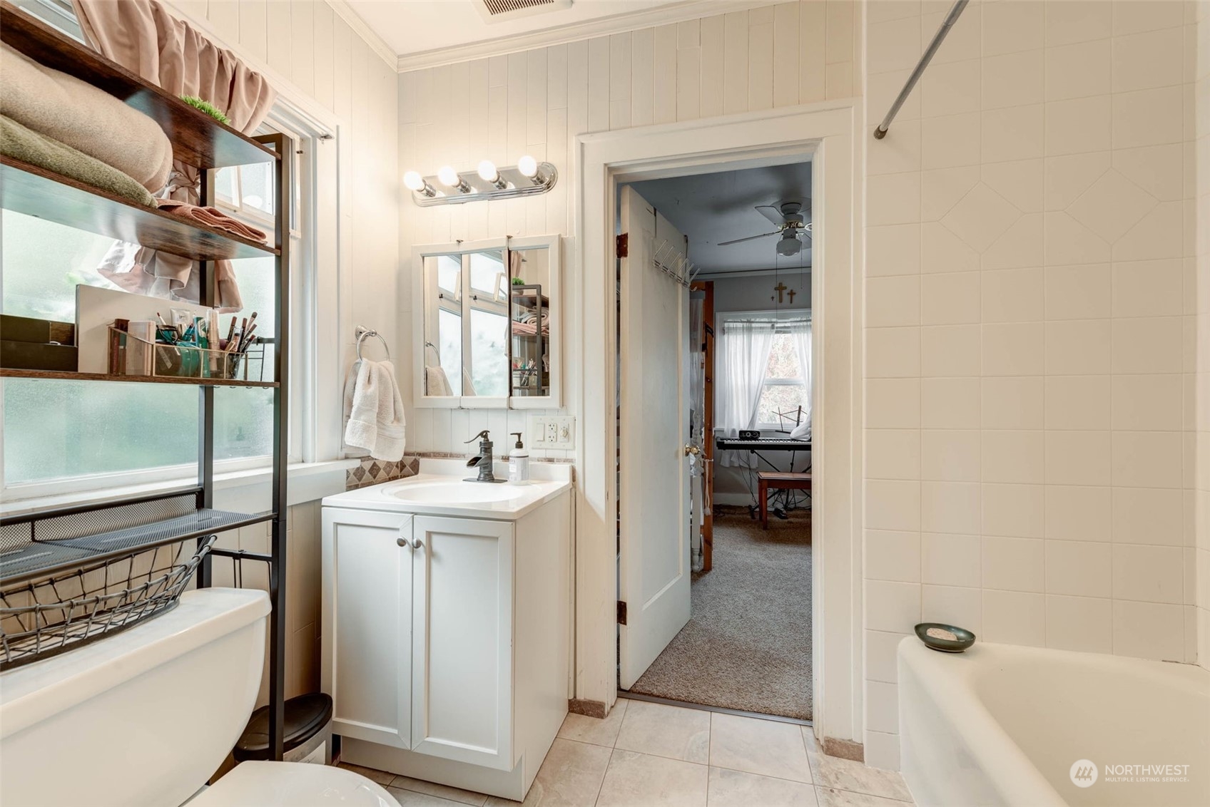 1709 Rainier Avenue Everett, WA 98201 - Photo 15 of 33 a bathroom with a sink a toilet and tub