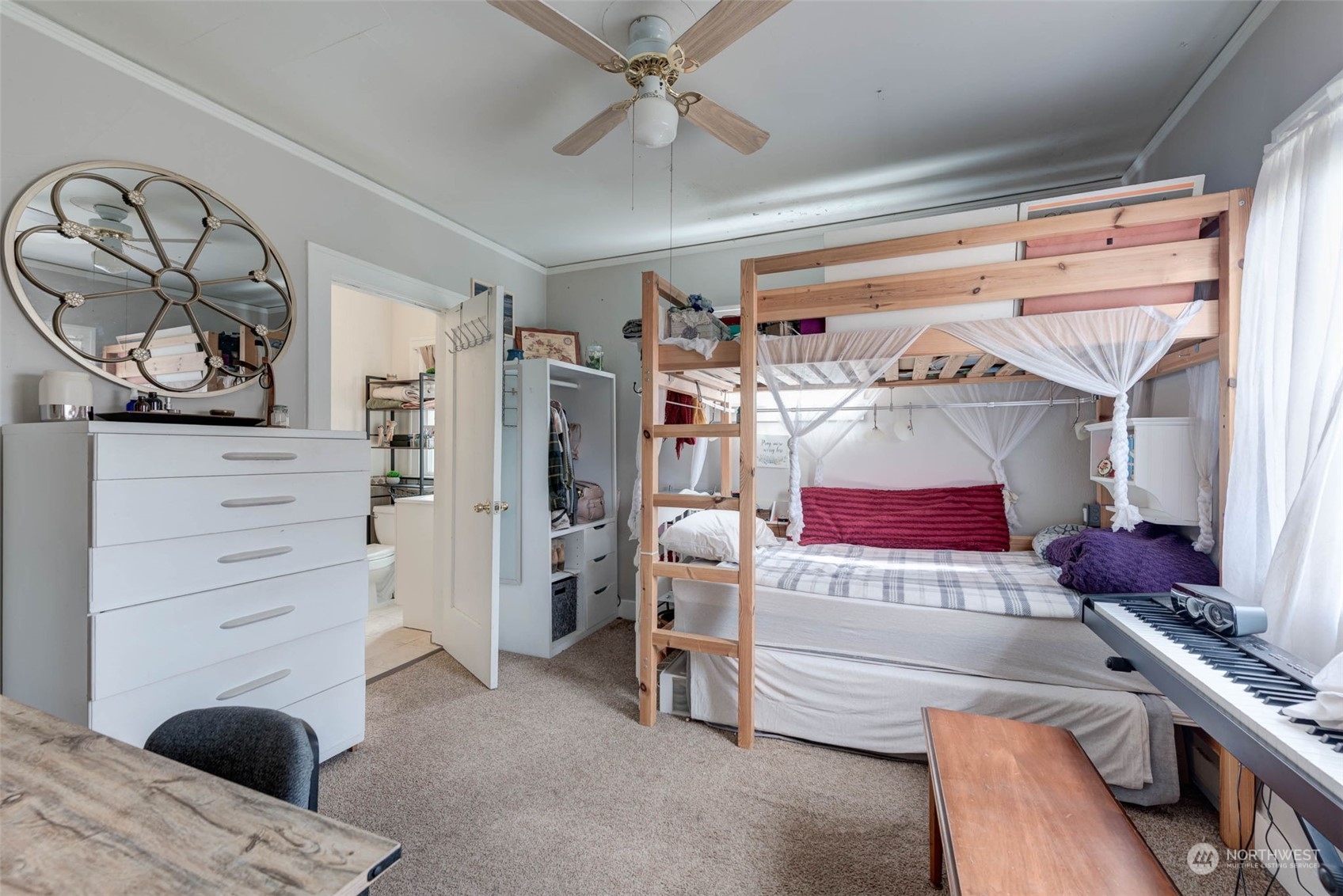 1709 Rainier Avenue Everett, WA 98201 - Photo 17 of 33 a bedroom with a bed and a dresser