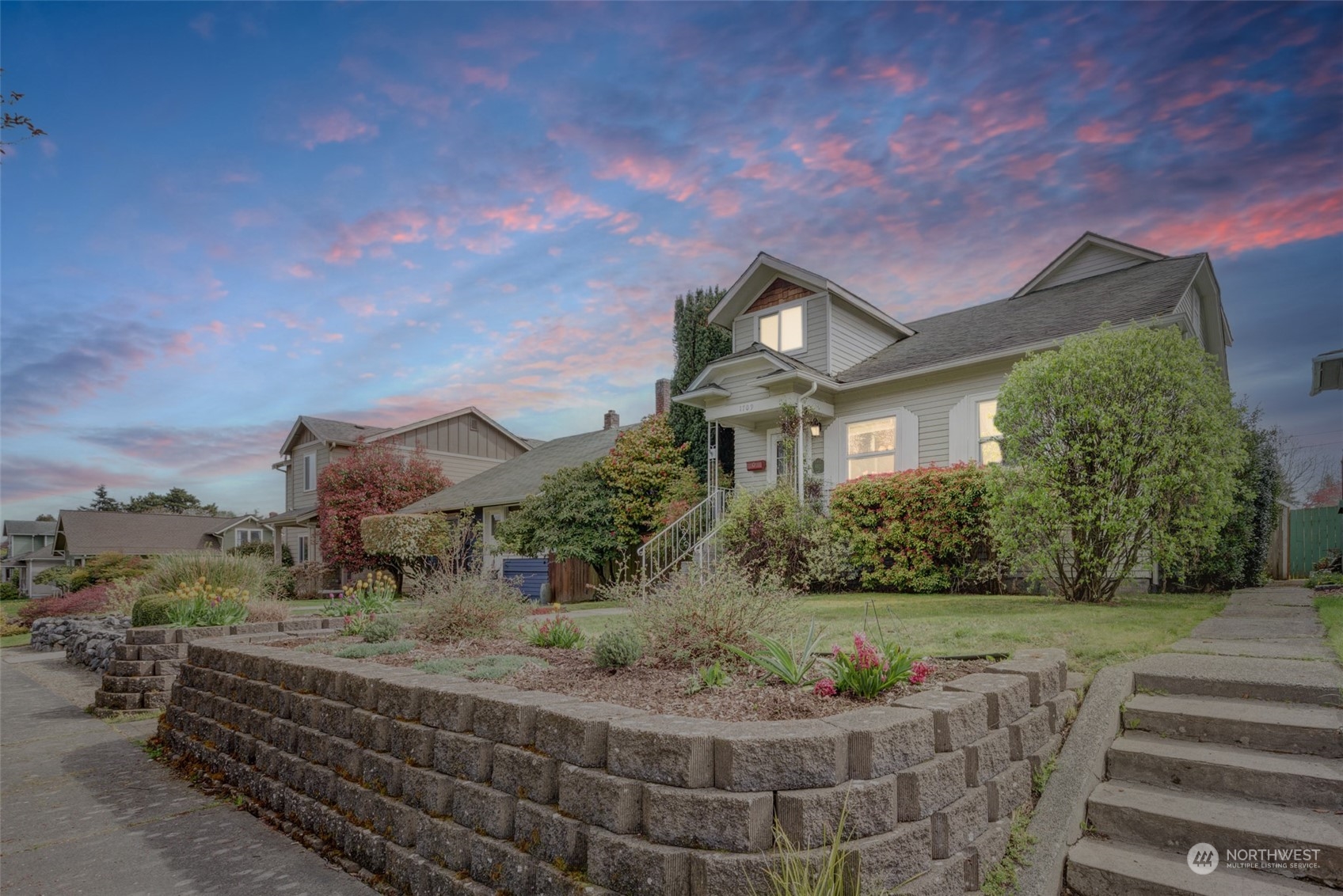 1709 Rainier Avenue Everett, WA 98201 - Photo 2 of 33 a front view of a house with a yard