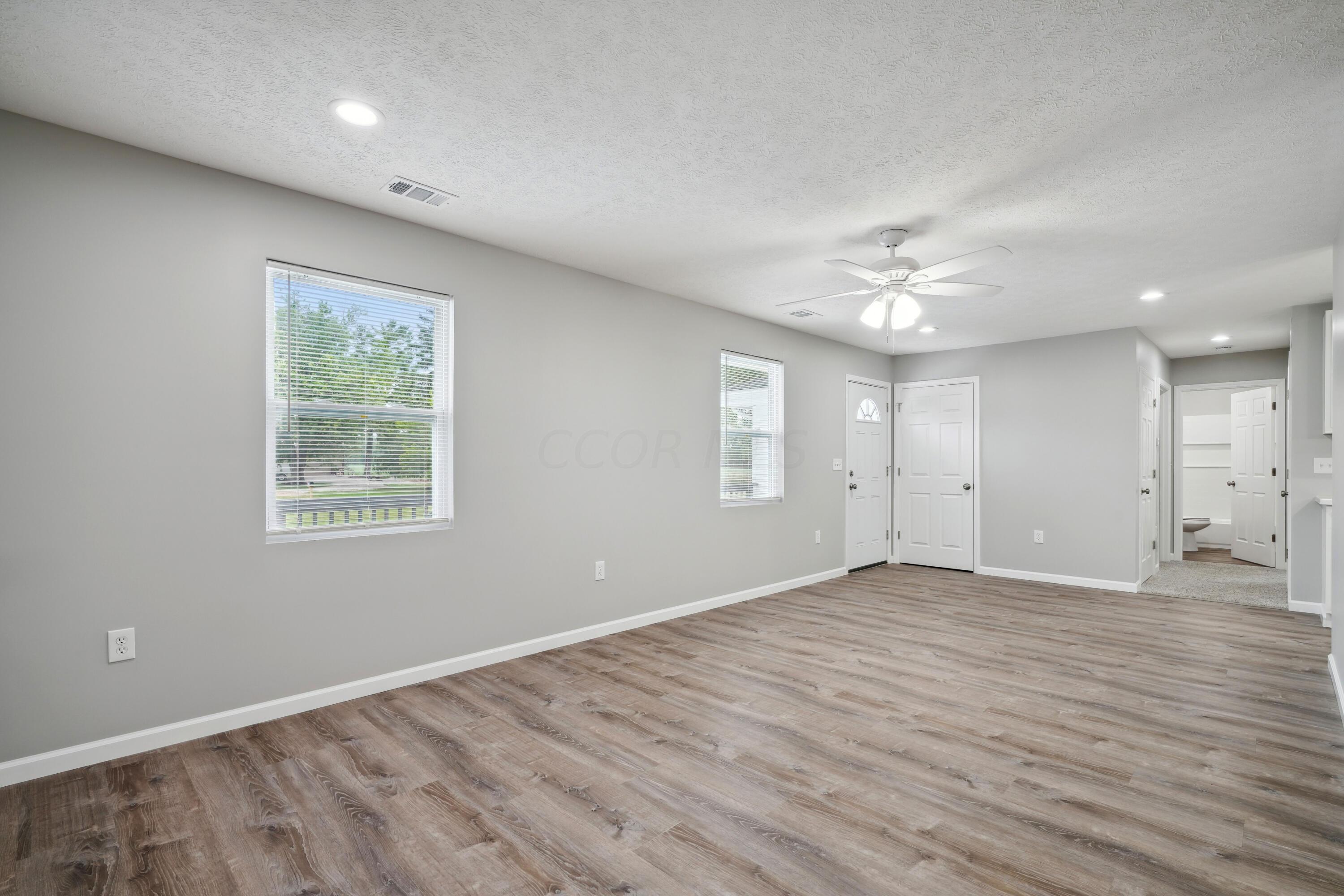 6705 Johnson Road Galloway, OH 43119 - Photo 5 of 30 Large Living Room with luxury vinyl flooring!