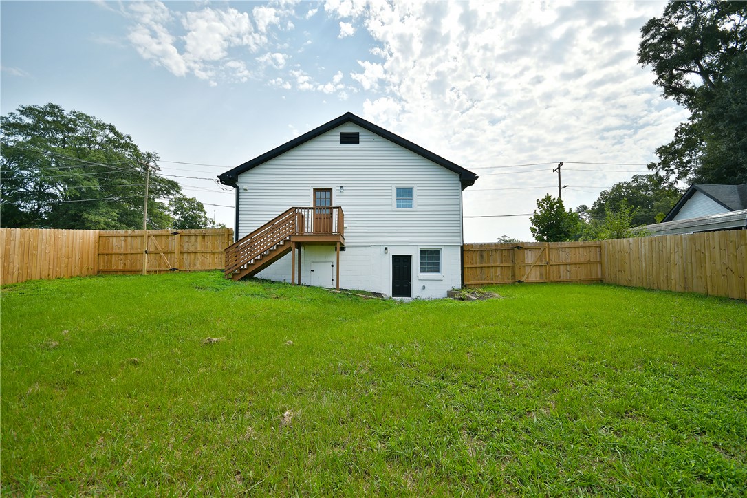 407 I Street Anderson, SC 29625 - Photo 39 of 43 A spacious, fenced backyard offers private outdoor living with convenient access to the home's main level.