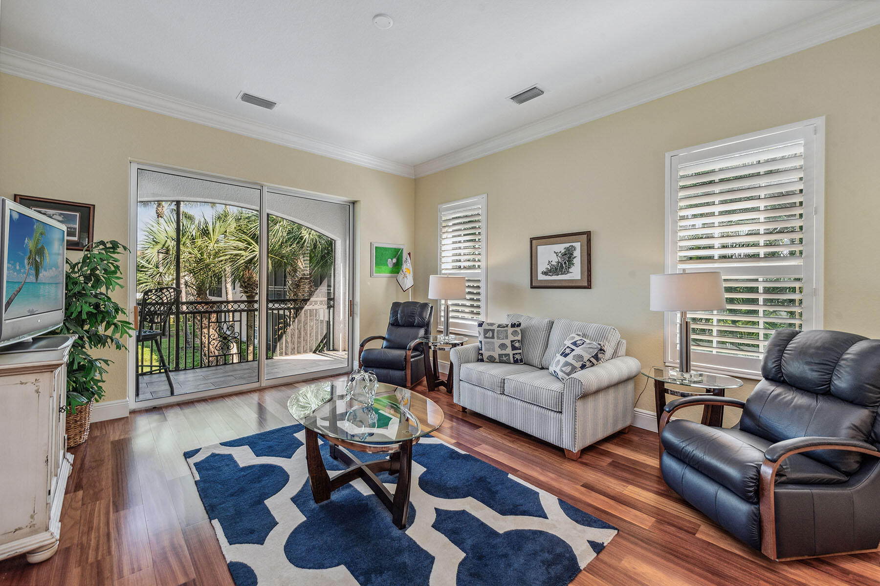 3189 Aviamar Circle, Unit 202 Naples, FL 34114 - Photo 12 of 50 a living room with furniture and a large window