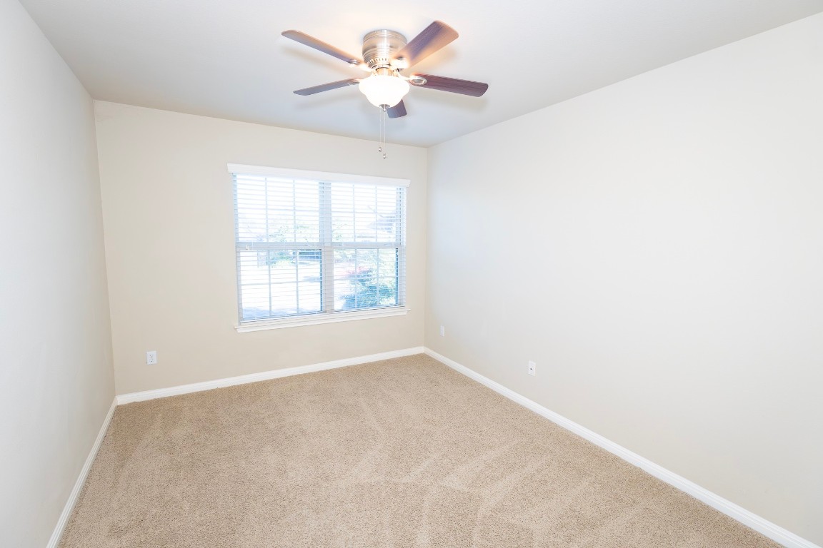 108 Mark Brooks Cove Round Rock, TX 78664 - Photo 18 of 24 an empty room with a window and a fan