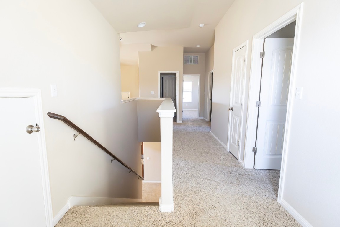 108 Mark Brooks Cove Round Rock, TX 78664 - Photo 21 of 24 a view of a hallway with stairs and furniture