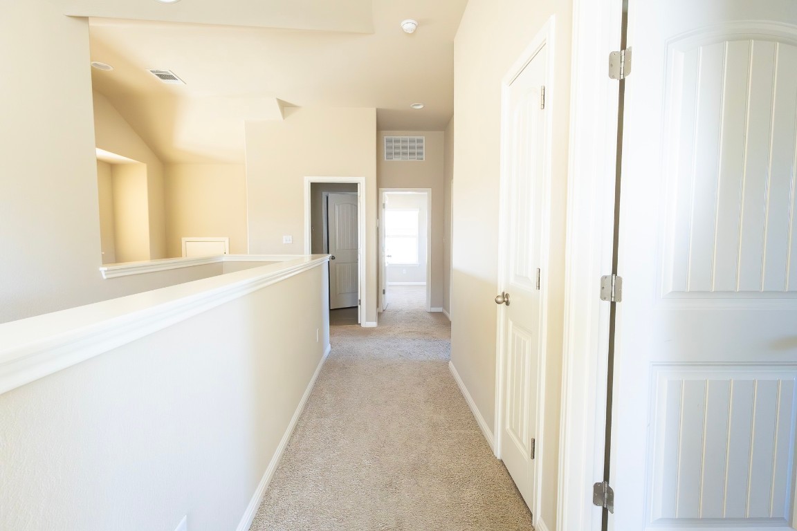 108 Mark Brooks Cove Round Rock, TX 78664 - Photo 22 of 24 a view of a hallway with wooden floor