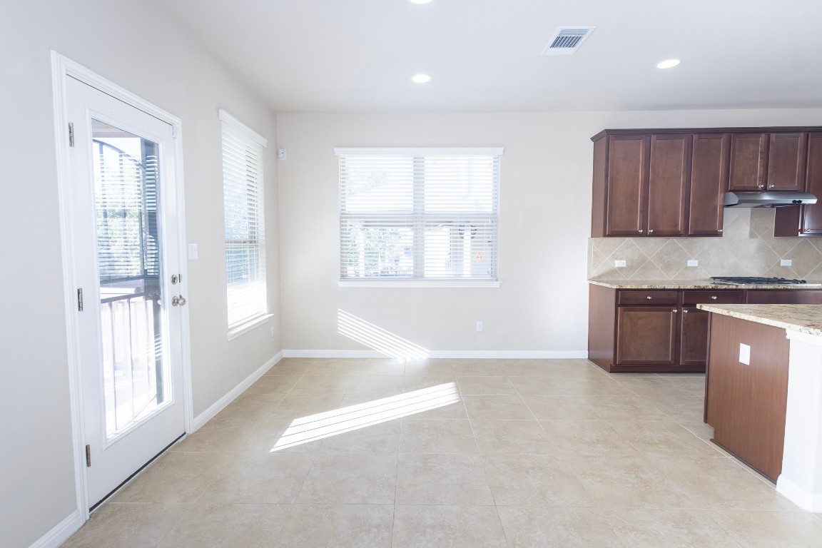 108 Mark Brooks Cove Round Rock, TX 78664 - Photo 8 of 24 a view of kitchen with wooden floor and electronic appliances