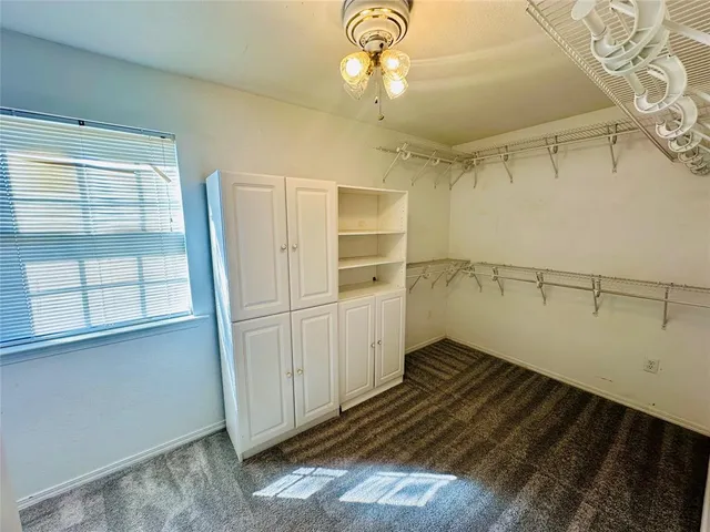 a view of a storage & utility room with a window