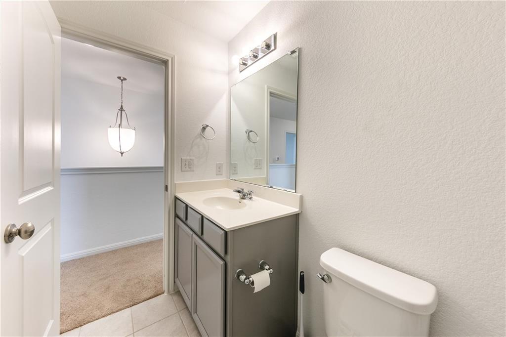 6708 Routenburn Street Austin, TX 78754 - Photo 12 of 21 a bathroom with a sink toilet and mirror