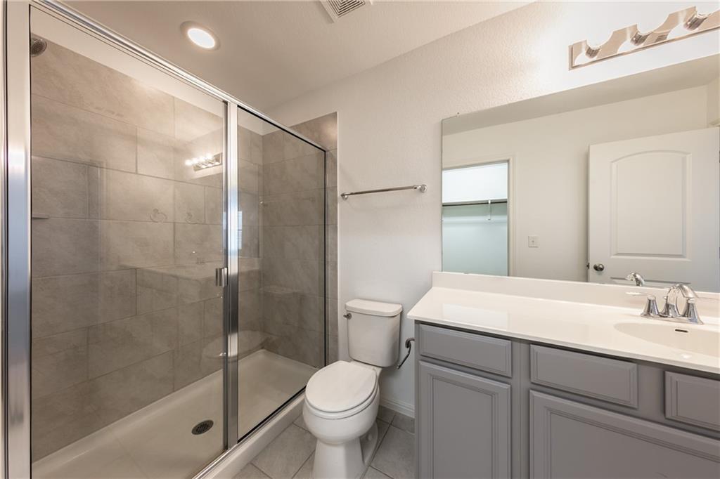 6708 Routenburn Street Austin, TX 78754 - Photo 19 of 21 a bathroom with a sink toilet and shower