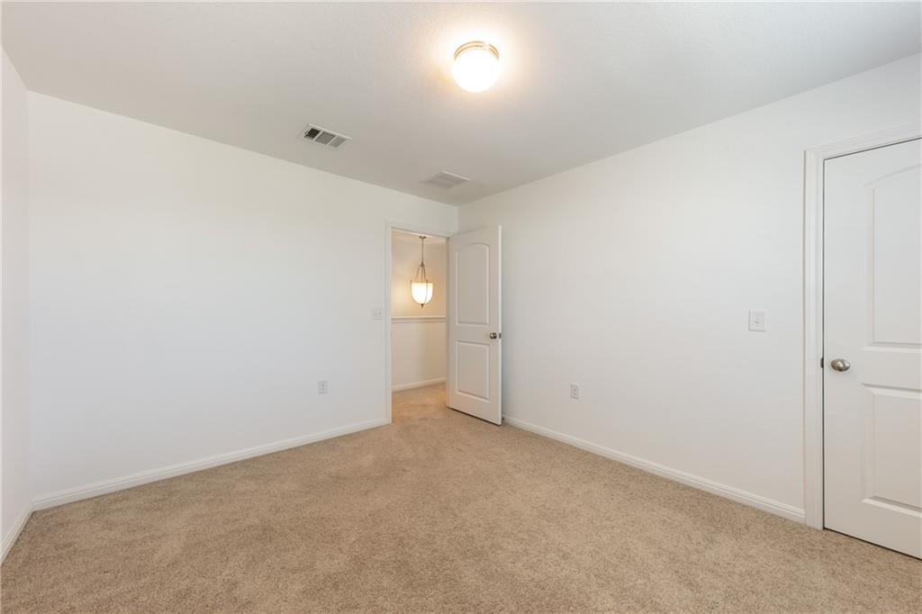 6708 Routenburn Street Austin, TX 78754 - Photo 9 of 21 an empty room with windows