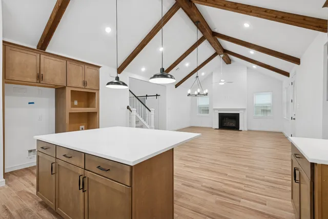 a room with a bed and a chandelier