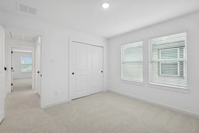 a view of room with window and bathroom