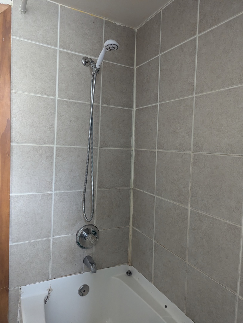 5708 West 84th Place Burbank, IL 60459 - Photo 9 of 15 a bathroom with a shower and a bathtub