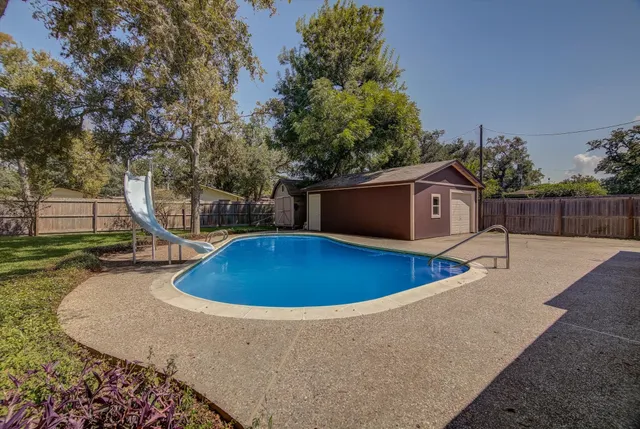 a view of a house with a swimming pool