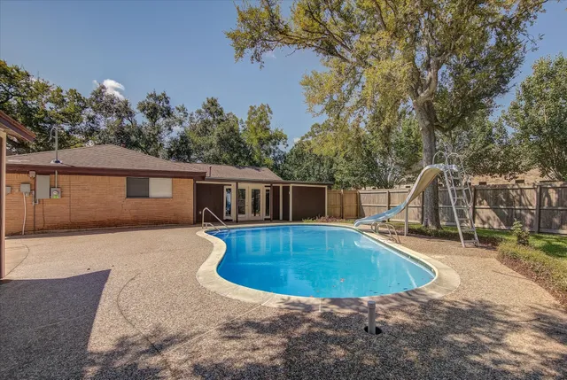 a view of garage yard and tree