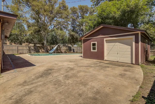 a view of an empty room with a fireplace