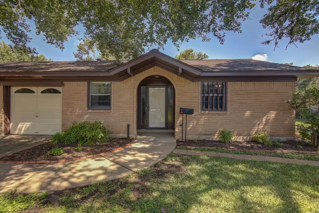 a house view with a garden space