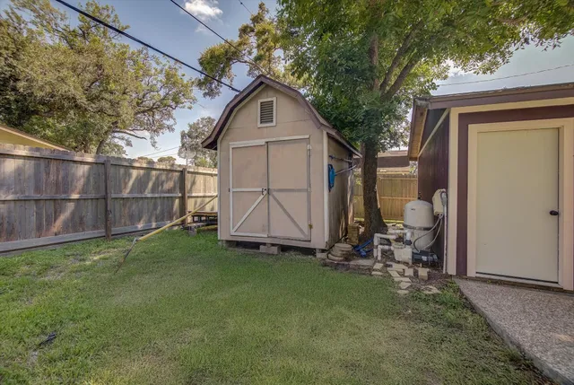 a front view of house with yard and trees
