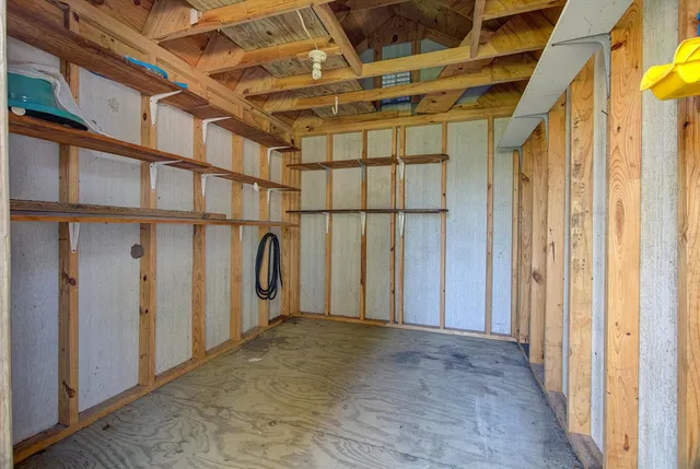 wooden view of a room with gym equipment