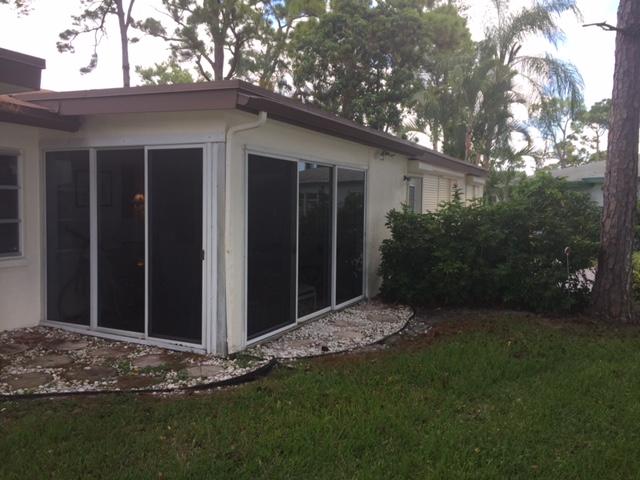 5400 Poppy Place, Unit B Delray Beach, FL 33484 - Photo 15 of 27 Glass Enclosed Patio from outside