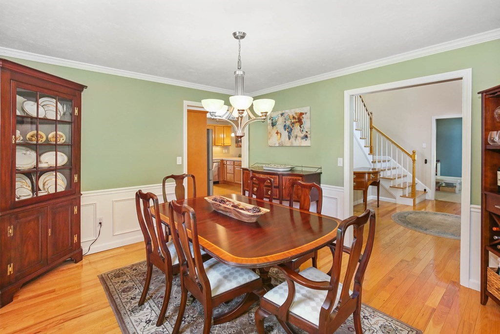 32 Tannery Road Sturbridge, MA 01518 - Photo 18 of 35 a dining room with furniture a chandelier and wooden floor