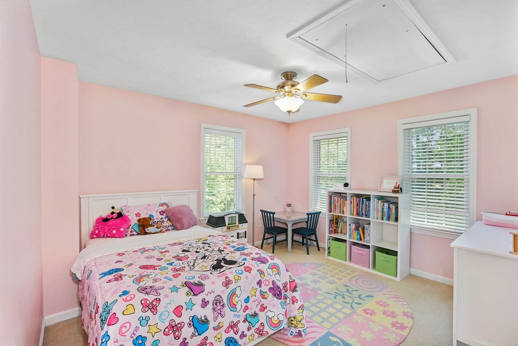 32 Tannery Road Sturbridge, MA 01518 - Photo 27 of 35 a bedroom with a bed a chandelier and a dresser