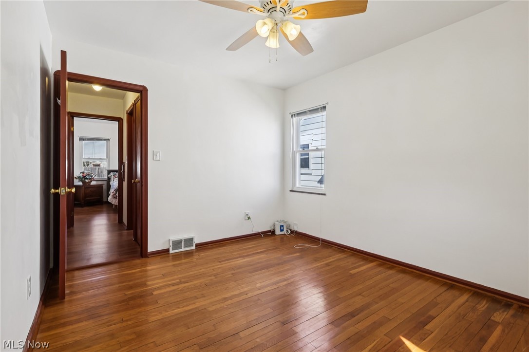 4252 Ridgeview Road Cleveland, OH 44144 - Photo 14 of 37 Spare room with dark wood-style floors and a ceiling fan