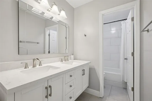 a bathroom with a sink a vanity and a mirror