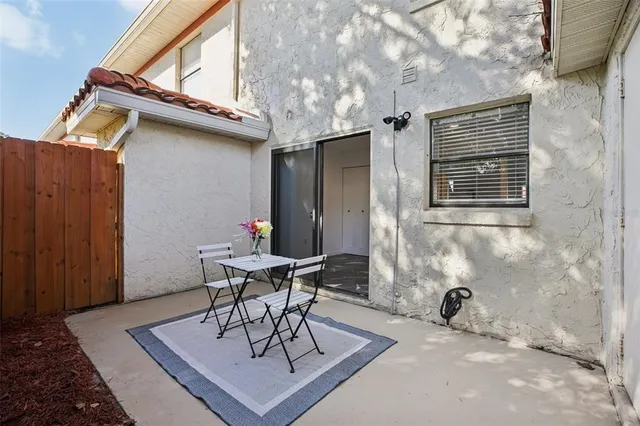 a table and chairs in a patio
