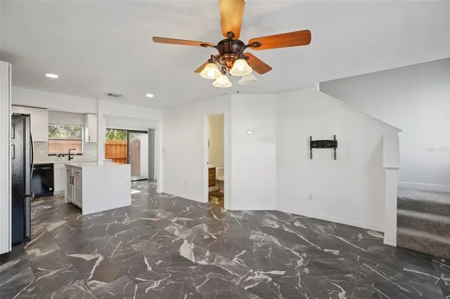 a view of a livingroom with a ceiling fan